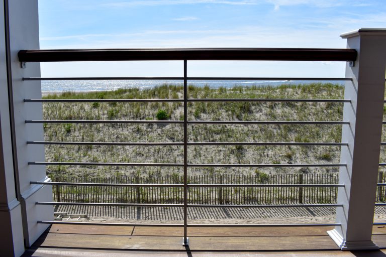 Modern Stainless steel terrace railing with round horizontal "pickets".