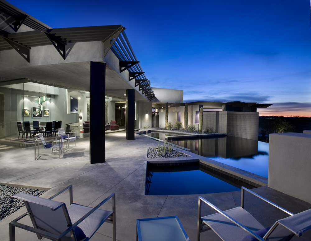 Modern patio with infinity pool, river rock, and concrete flooring.

Architect: Urban Design Associates
Builder: RS Homes
Interior Designer: Tamm Jasper Interiors
Photo Credit: Dino Tonn
by Urban Design Associates | Pool design | Pool Contracting | Swimming Pool Ideas | Swimming Pool Design Ideas
