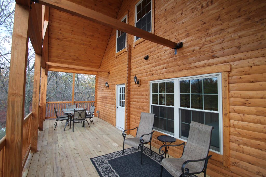 Mountain style back porch idea in Philadelphia with decking and a roof extension by Conestoga Log Cabins | Outdoor Photos | Porch | Landscaping | Landscape Design | Outdoor Living Space | Porch Design Ideas | Outdoor Living Space Ideas | Backyard Design