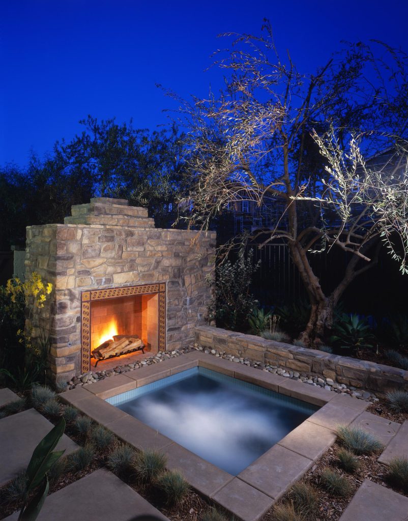 Mountain style backyard rectangular hot tub photo in San Diego