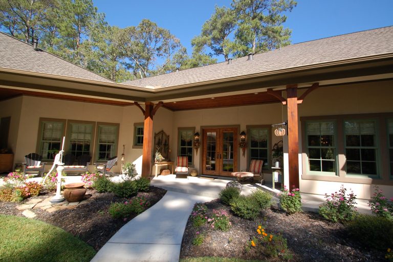 Mountain style concrete back porch photo in Houston with a roof extension by Possibility Custom Homes, Inc. | Outdoor Photos | Porch | Landscaping | Landscape Design | Outdoor Living Space | Porch Design Ideas | Outdoor Living Space Ideas | Backyard Design