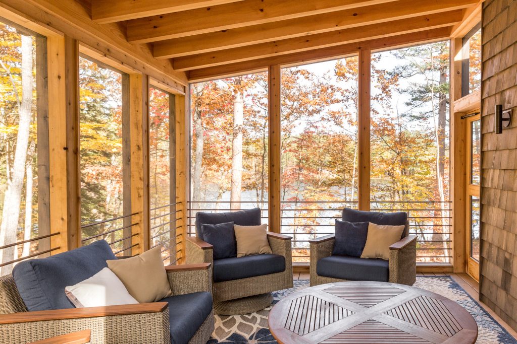 Mountain style screened-in porch photo in Portland Maine with decking and a roof extension by Maine Passive House | Outdoor Photos | Porch | Landscaping | Landscape Design | Outdoor Living Space | Porch Design Ideas | Outdoor Living Space Ideas | Backyard Design