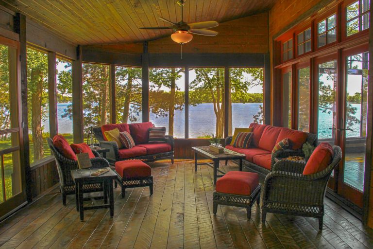 Mountain style screened-in side porch photo in Minneapolis with a roof extension by Bercher Design & Construction | Outdoor Photos | Porch | Landscaping | Landscape Design | Outdoor Living Space | Porch Design Ideas | Outdoor Living Space Ideas | Backyard Design