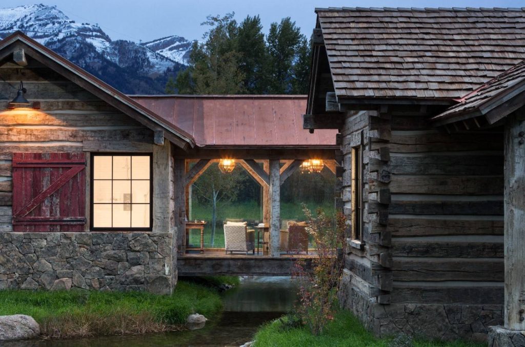 Mountain style side porch photo in Other with a roof extension by Revient Reclaimed Wood | Outdoor Photos | Porch | Landscaping | Landscape Design | Outdoor Living Space | Porch Design Ideas | Outdoor Living Space Ideas | Backyard Design