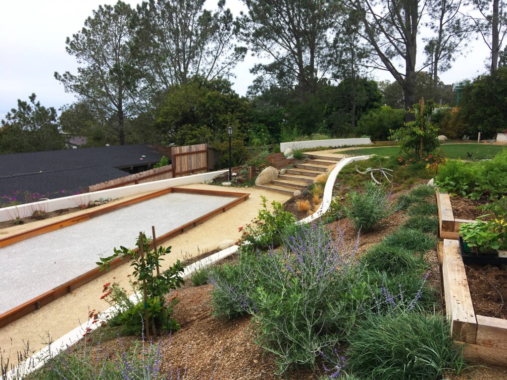 Naturalistic meadow with feather grass and lavender and bocce ball court.