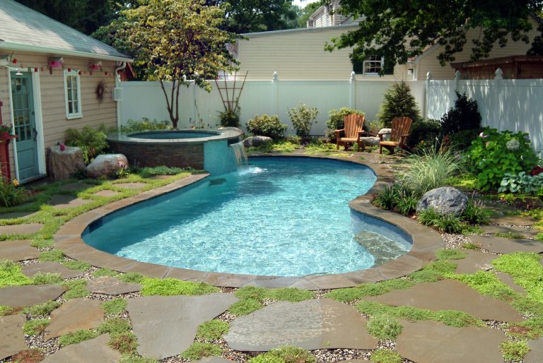 Nestled in a cozy backyard, this pool allows the homeowners to relax, cool off, and enjoy.