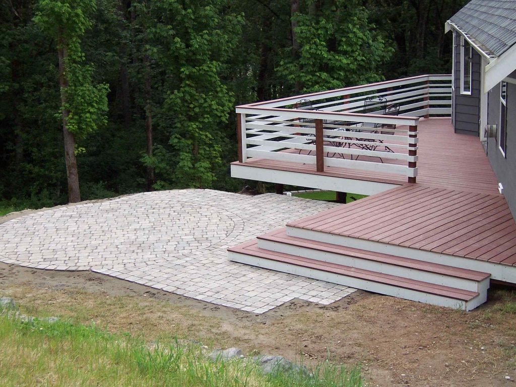 New deck built in double triangle worked well with the slope below, and allowed a paver patio to fit at top of the hill as well. Deck is Trex accents, pavers are Mutual Materials Paleo in Harvest blend.