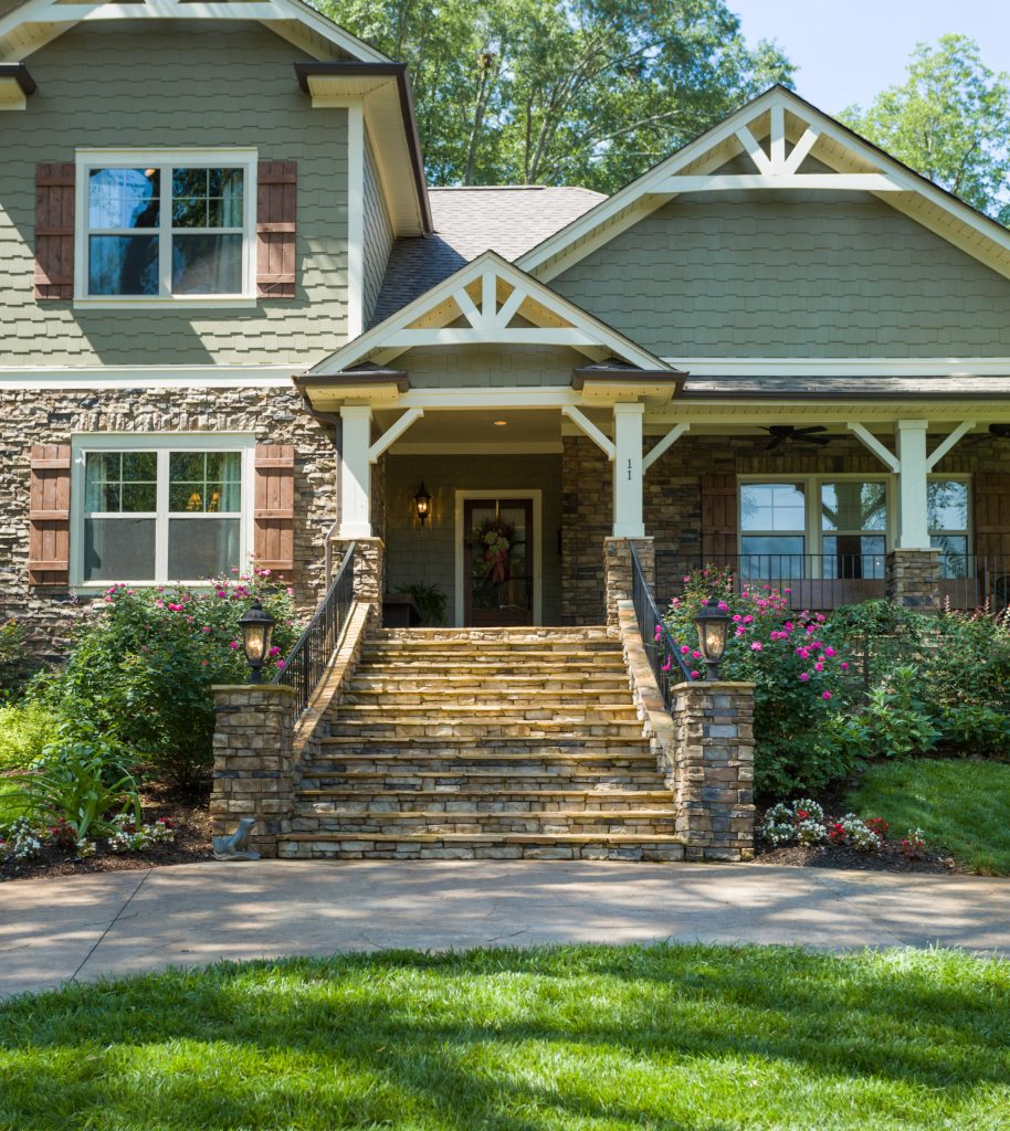New front porch and wide stone steps.