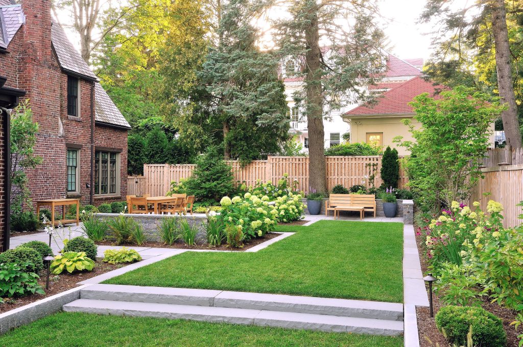 Newton, MA landscape renovation with bluestone patio, seat walls, privacy fence and planting garden. - Sallie Hill Design | Landscape Architecture | 339-970-9058 | salliehilldesign.com | photo ©2015 Brian Hill
