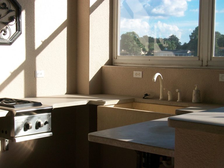 Notice the yellow cement sink and grey concrete countertops. Susan Roederer