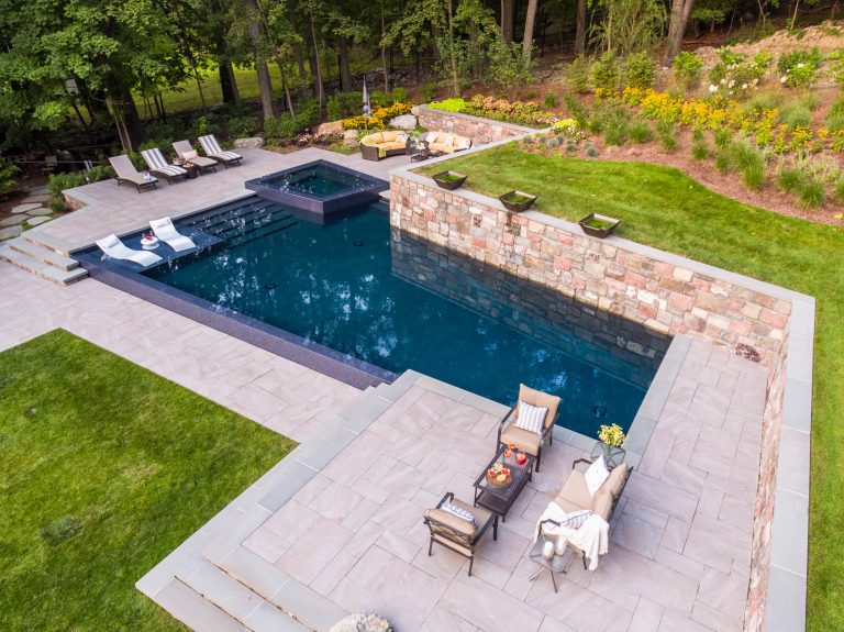 Outdoor Porcelain Tile from Mountain Hardscaping. In Photo: Quartz Silver with Bluestone Stair Treads | Installation done by: Thomas Flint Landscape Design & Development