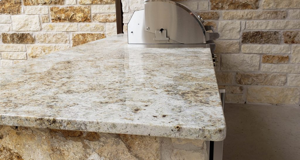 Outdoor grill with colonial cream granite countertops.