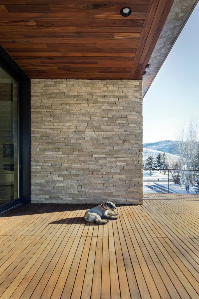 Outdoor kitchen deck - huge contemporary rooftop outdoor kitchen deck idea in Salt Lake City with a roof extension