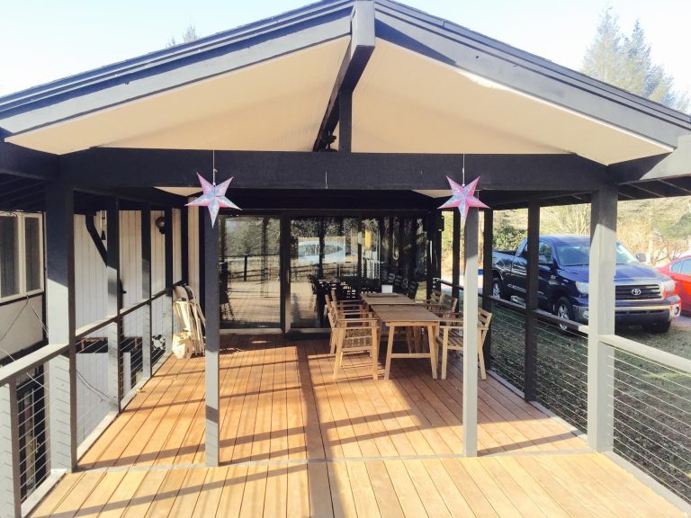 Outdoor kitchen deck - large 1950s backyard outdoor kitchen deck idea in Philadelphia with a roof extension