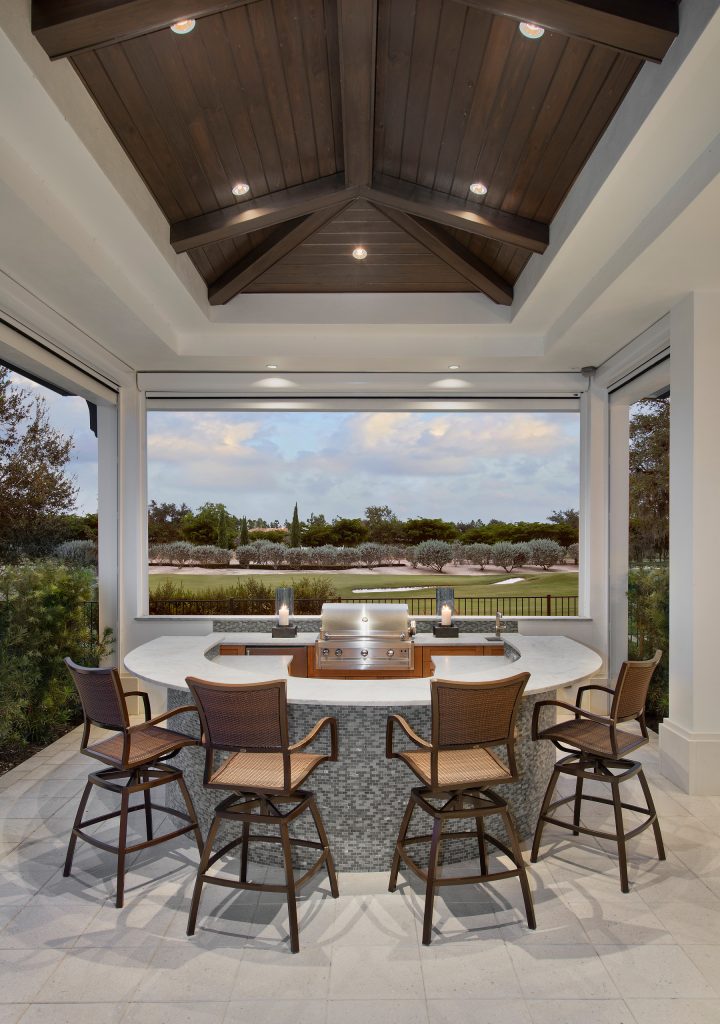 Outdoor kitchen deck - large transitional backyard outdoor kitchen deck idea in Miami with a roof extension