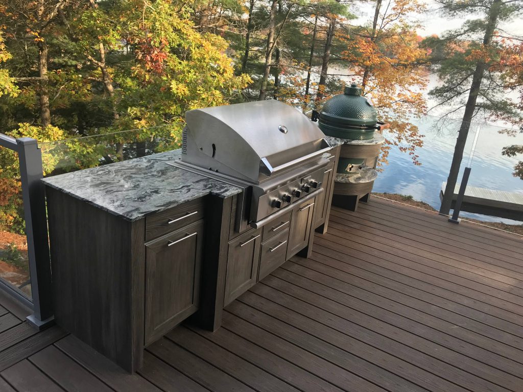 Outdoor kitchen deck - outdoor kitchen deck idea in Detroit with no cover