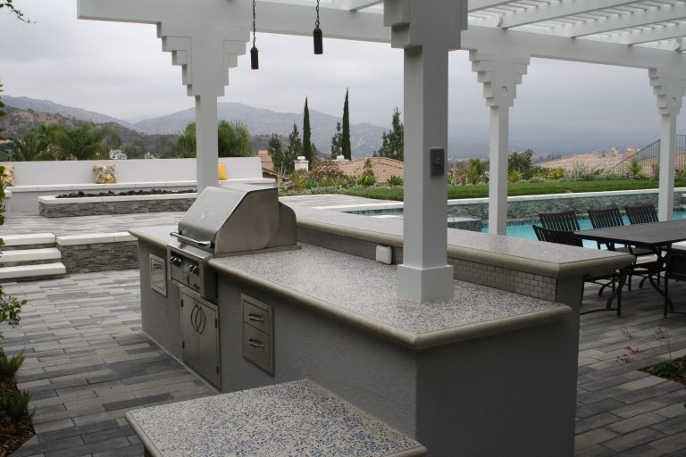 Outdoor kitchen, fire pit, outdoor dining room, and swimming pool