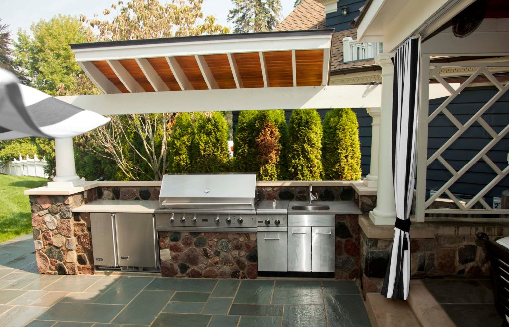 Outdoor kitchen highlights include; 53” grill, gas cooktop, refrigerator, ice maker, wet sink and storage cabinets. The cantilevered ceiling offers protection from the elements.