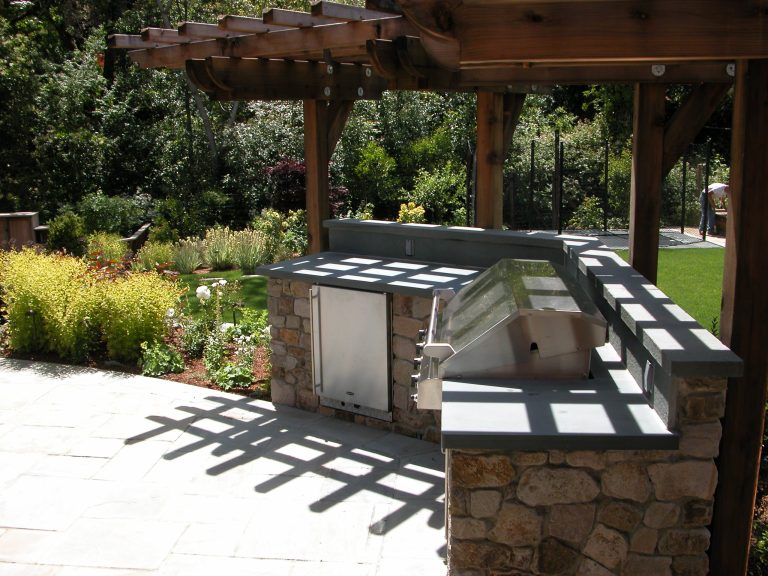 Outdoor kitchen with grill and bluestone counter top. photo by Galen Fultz