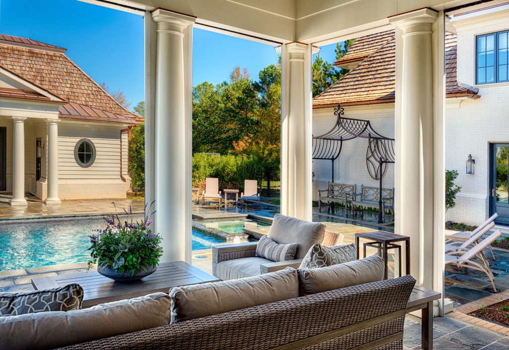 Outdoor living area overlooking the in-ground pool.Getz Creative Photography