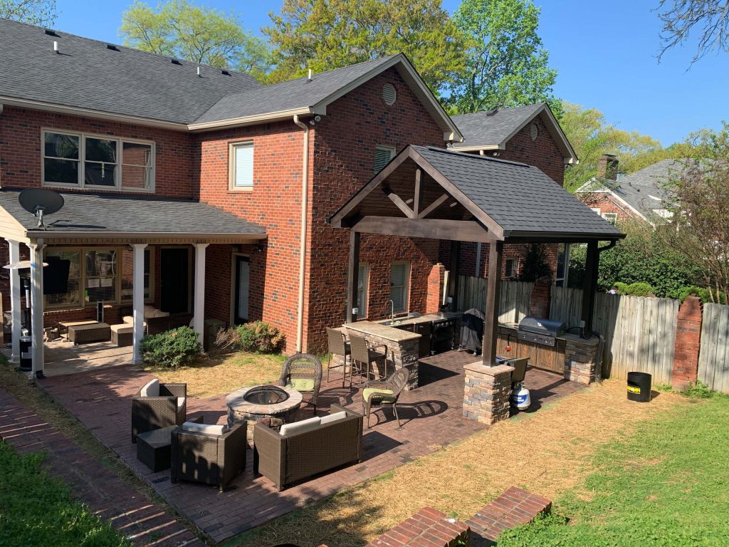 Outdoor patio, pavilion, kitchen for cooking out and firepit family entertainment area.