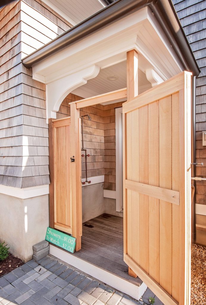 Outdoor shower deck - coastal outdoor shower deck idea in New York with an awning