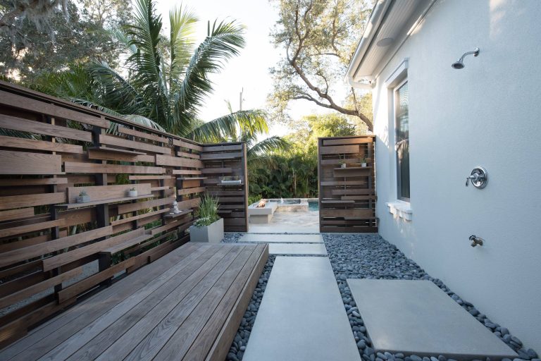 Outdoor shower deck - contemporary side yard outdoor shower deck idea in Tampa with no cover