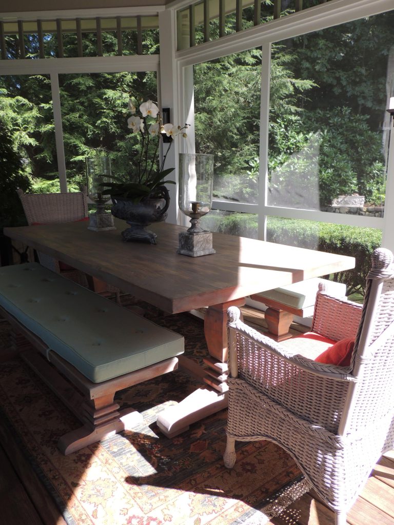 Outdoor space furnished with exquisite antiques and contemporary pieces. Also custom dining table, benches and cushions.