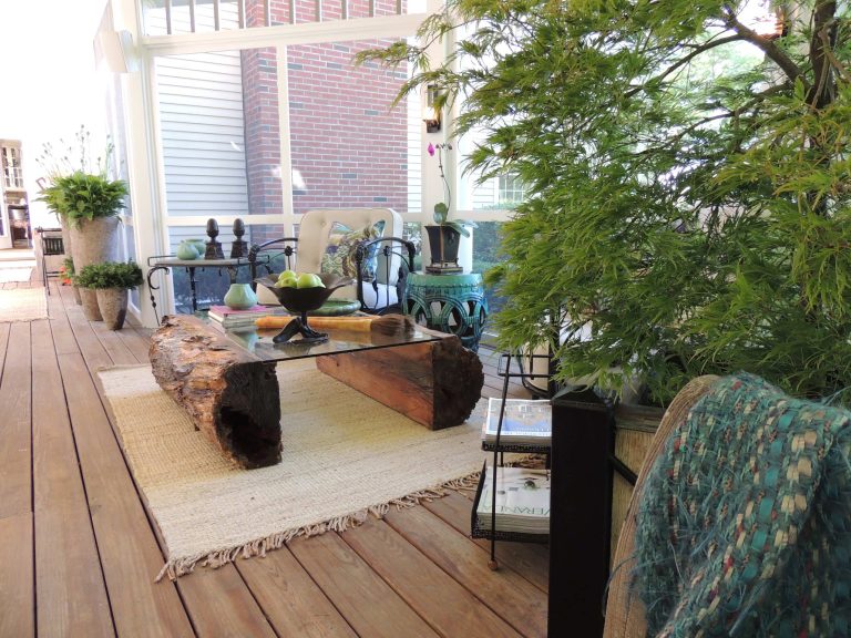 Outdoor space furnished with exquisite antiques and contemporary pieces. Also custom dining table, benches and cushions.