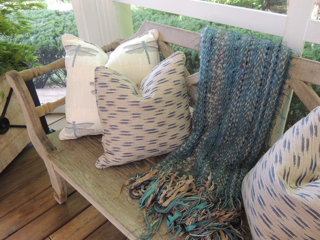 Outdoor space furnished with exquisite antiques and contemporary pieces. Also custom dining table, benches and cushions.