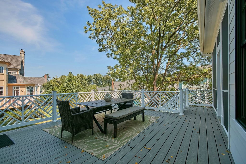 Outside portion of back porch with stairs to the backyard.