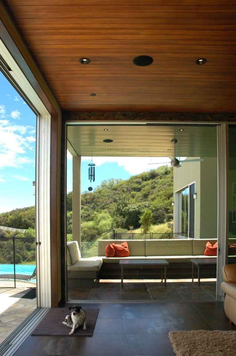 Over size sliding doors to the dramatic patio view and lap pool. Photos by Diane Crea