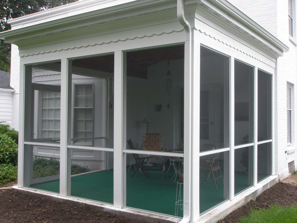 PHB Construction LLC Built this three seasons porch with tongue and groove stained ceilings. Scallops to match existing fascia.
