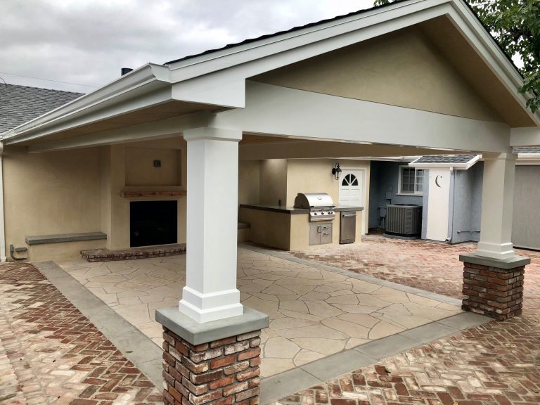 Patio Cover attached to the house with brick columns, flagstone and brick paving
