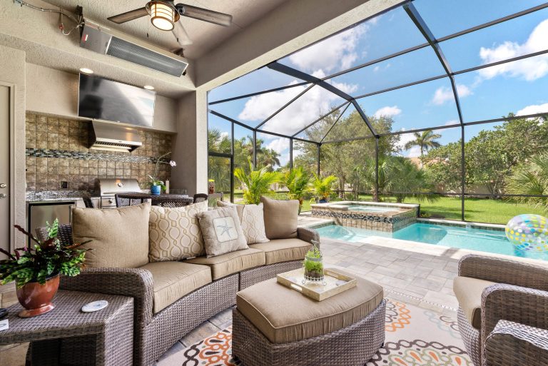 Patio kitchen - coastal backyard patio kitchen idea in Miami with a roof extension