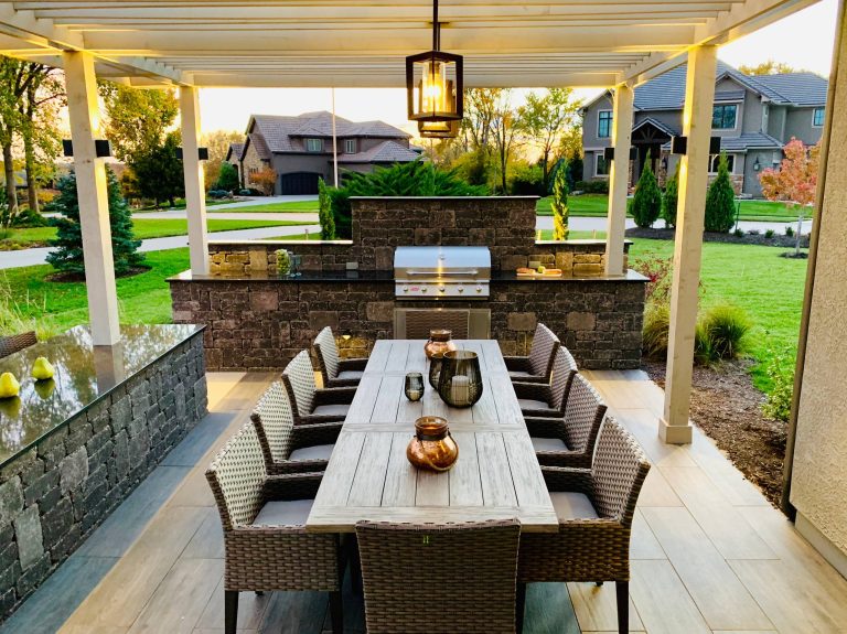 Patio kitchen - contemporary backyard patio kitchen idea in Kansas City with a pergola