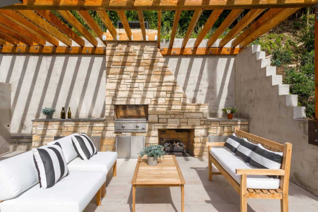 Patio kitchen - contemporary backyard patio kitchen idea in Los Angeles with a pergola