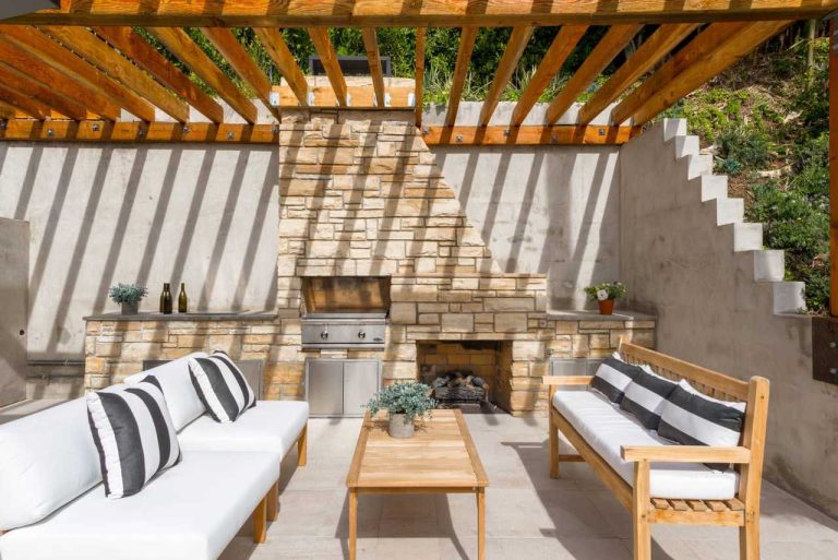 Patio kitchen - contemporary backyard patio kitchen idea in Los Angeles with a pergola