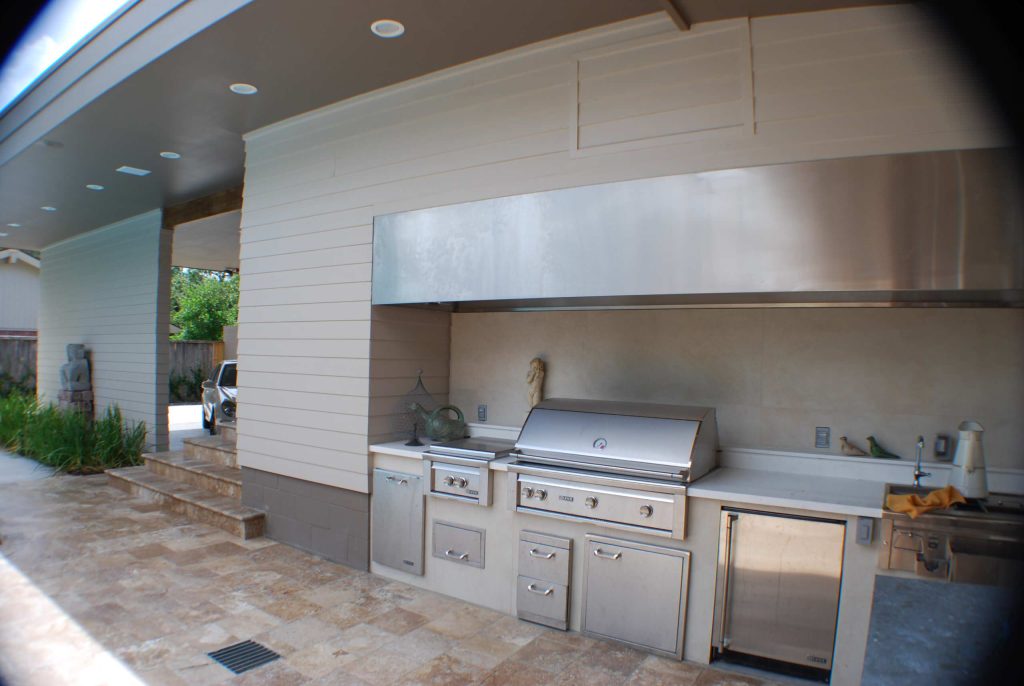 Patio kitchen - contemporary backyard tile patio kitchen idea in Houston with a roof extension
