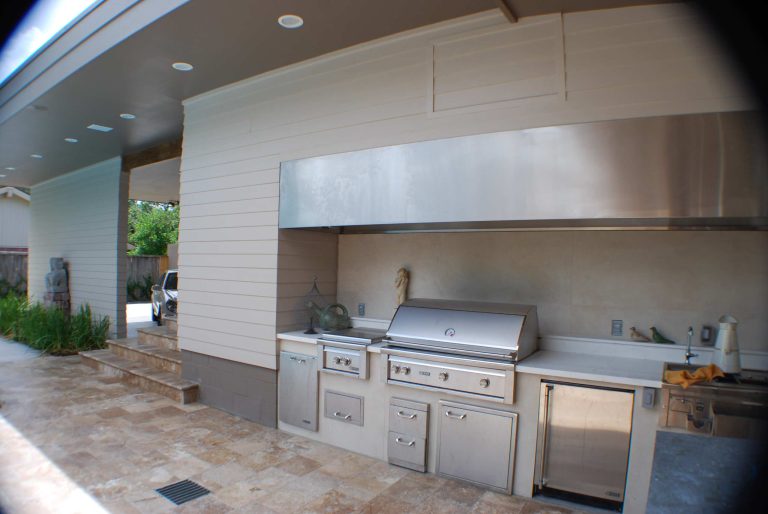 Patio kitchen - contemporary backyard tile patio kitchen idea in Houston with a roof extension