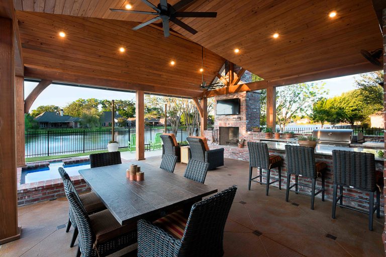 Patio kitchen - cottage backyard concrete patio kitchen idea in Other with a roof extension