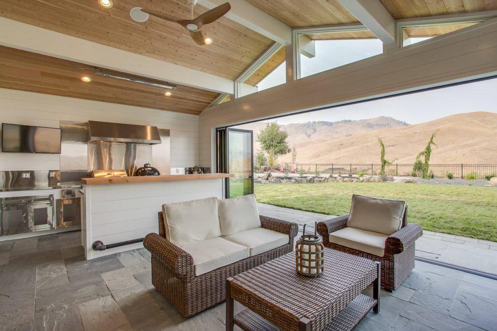 Patio kitchen - cottage backyard tile patio kitchen idea in Seattle with a roof extension