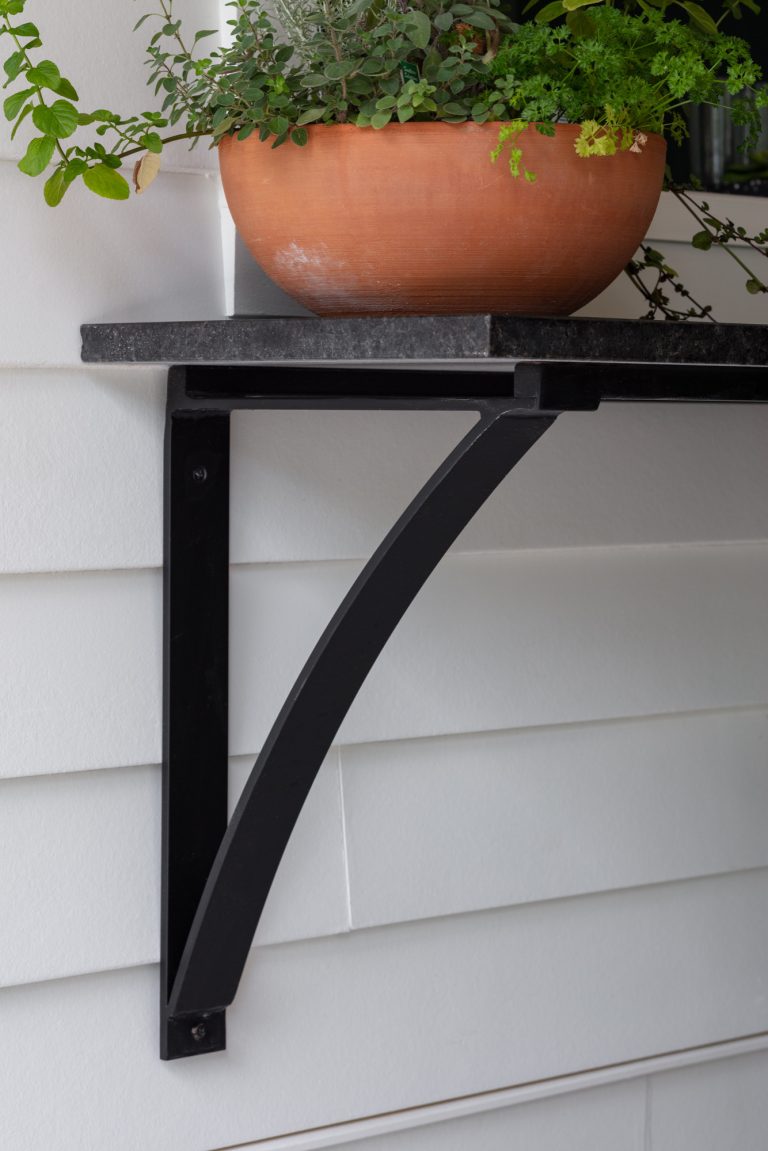 Patio kitchen - country backyard patio kitchen idea in Other