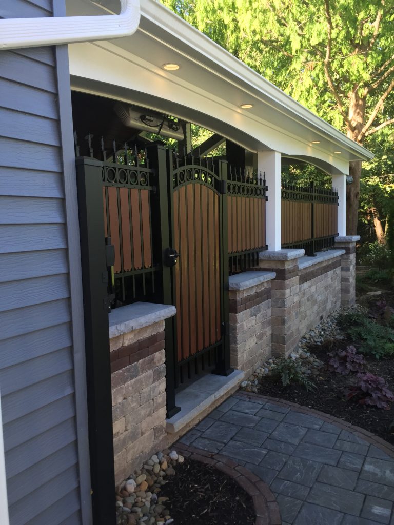 Patio kitchen - huge craftsman backyard brick patio kitchen idea in Cleveland with a roof extension