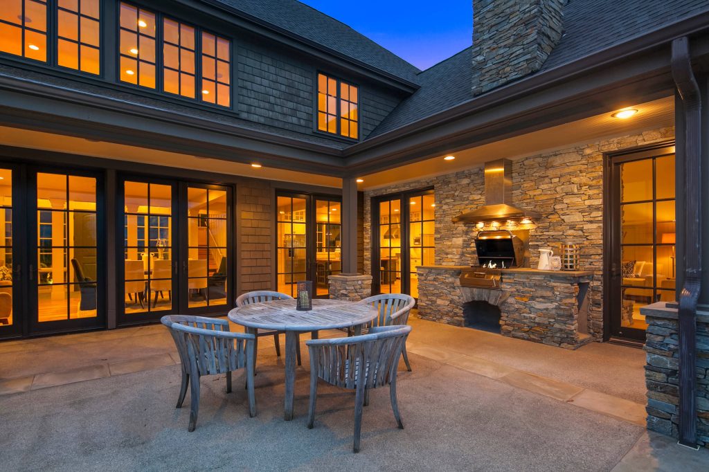 Patio kitchen - huge traditional backyard concrete patio kitchen idea in Seattle with no cover
