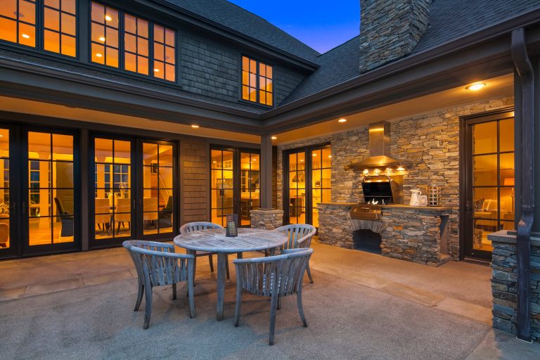 Patio kitchen - huge traditional backyard concrete patio kitchen idea in Seattle with no cover