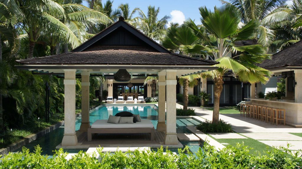 Patio kitchen - huge tropical backyard tile patio kitchen idea in Hawaii with a gazebo