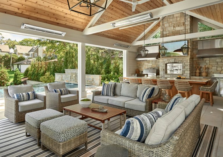 Patio kitchen - large coastal backyard stone patio kitchen idea in Chicago with a roof extension