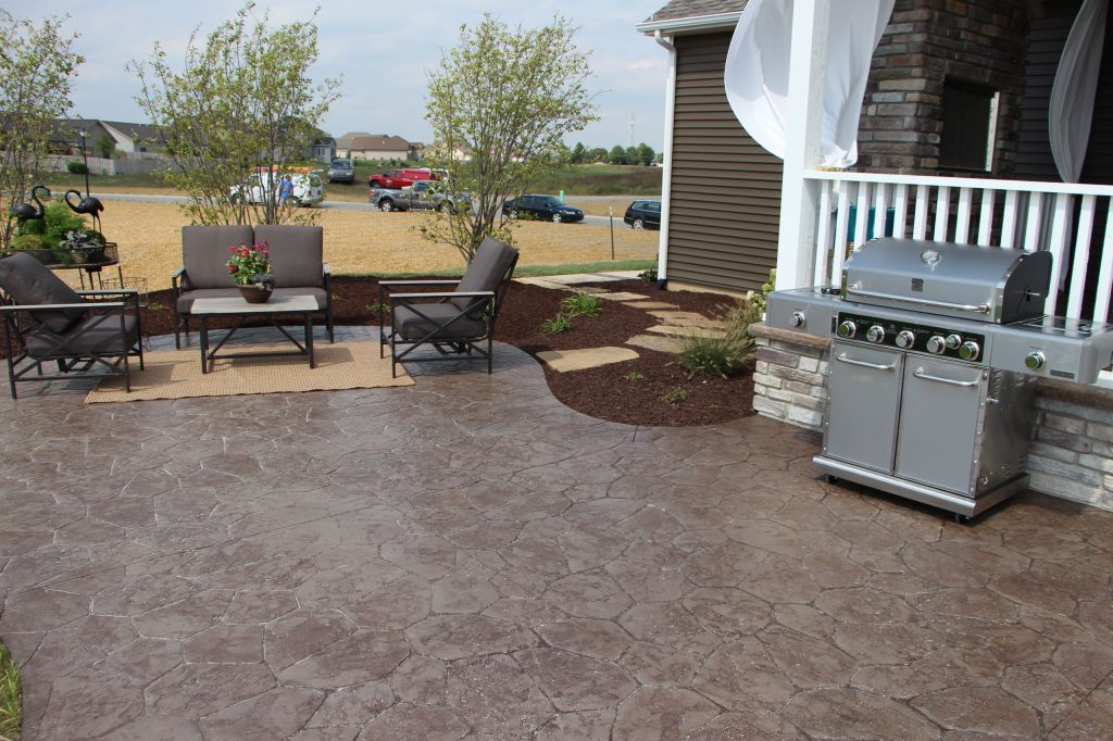 Patio kitchen - large coastal backyard stone patio kitchen idea in Indianapolis with a roof extension