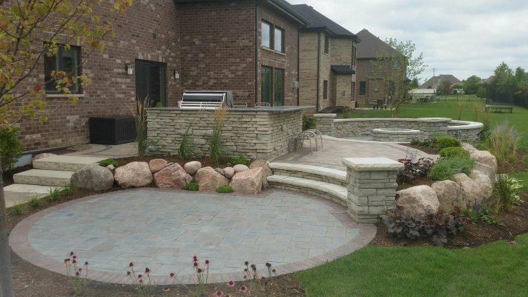 Patio kitchen - large contemporary backyard concrete paver patio kitchen idea in Chicago with no cover